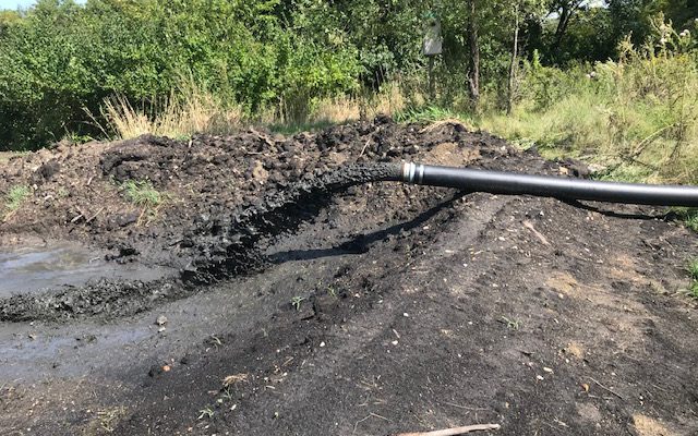 Submersible pumps bringing up the muck and sediment from a body of water